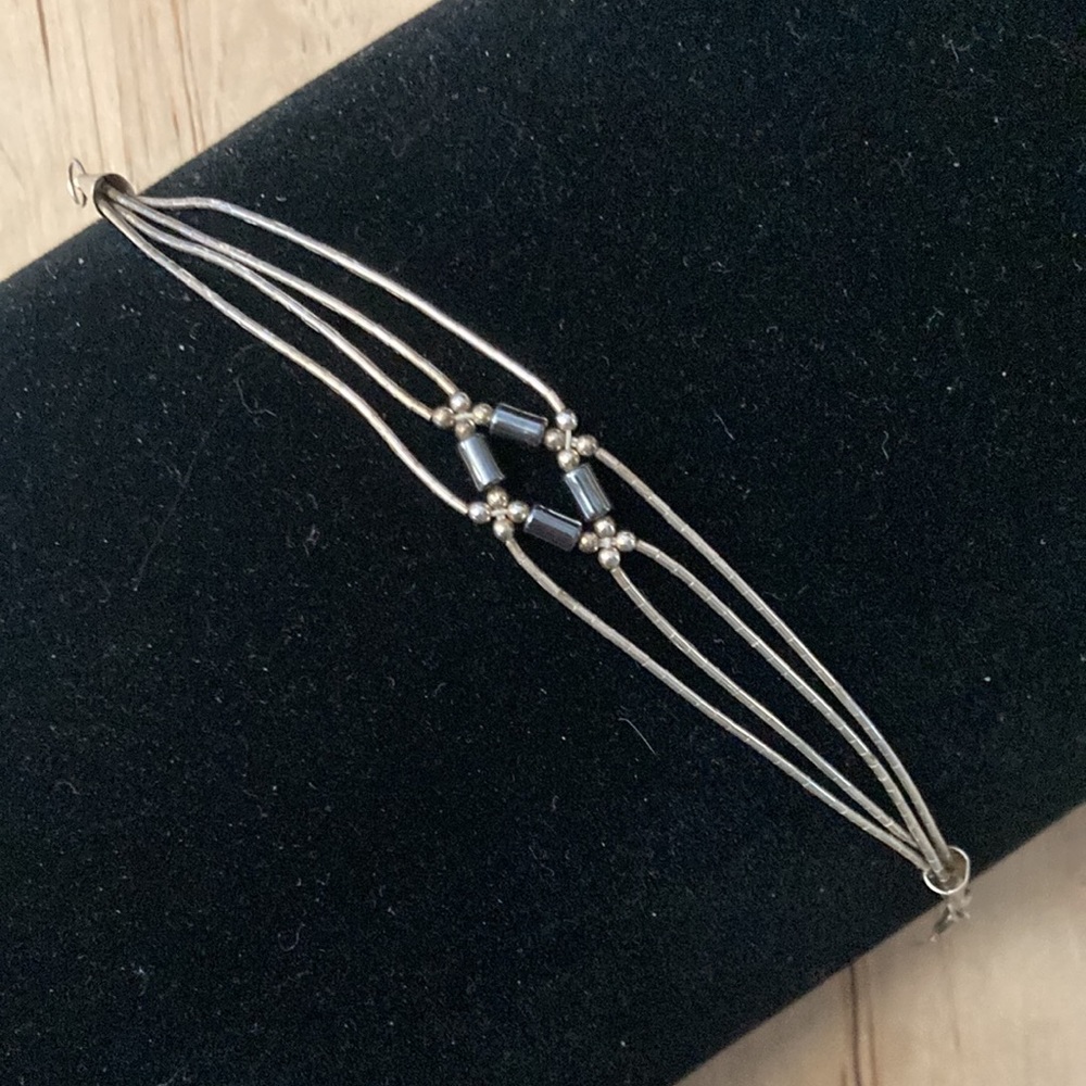 Sterling braided liquid silver Hematite 4 strand 7" bracelet